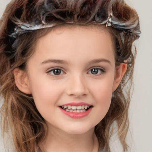 Joyful white child female with medium  brown hair and brown eyes