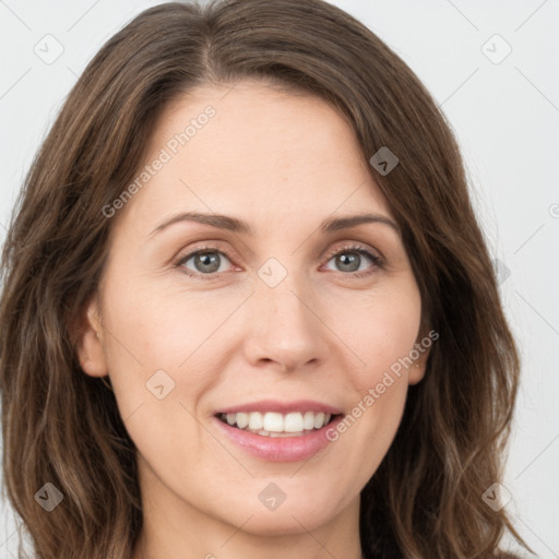 Joyful white young-adult female with long  brown hair and green eyes