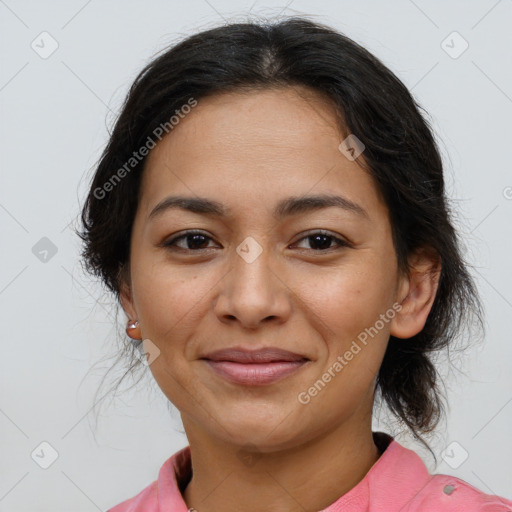 Joyful latino young-adult female with medium  brown hair and brown eyes