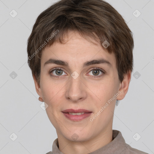 Joyful white young-adult female with short  brown hair and grey eyes