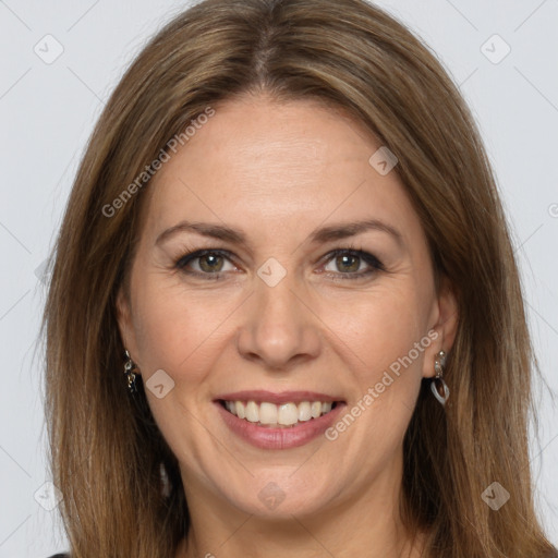 Joyful white adult female with long  brown hair and grey eyes