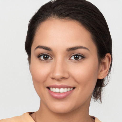 Joyful white young-adult female with medium  brown hair and brown eyes