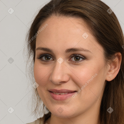 Joyful white young-adult female with long  brown hair and grey eyes