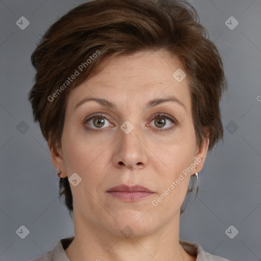 Joyful white adult female with short  brown hair and grey eyes