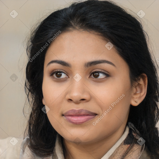 Joyful latino young-adult female with long  brown hair and brown eyes