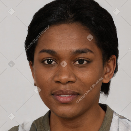 Joyful black young-adult female with short  black hair and brown eyes