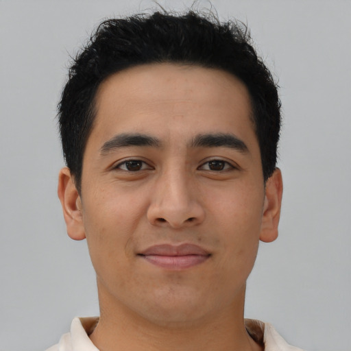 Joyful asian young-adult male with short  brown hair and brown eyes