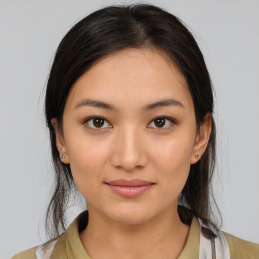 Joyful white young-adult female with medium  brown hair and brown eyes