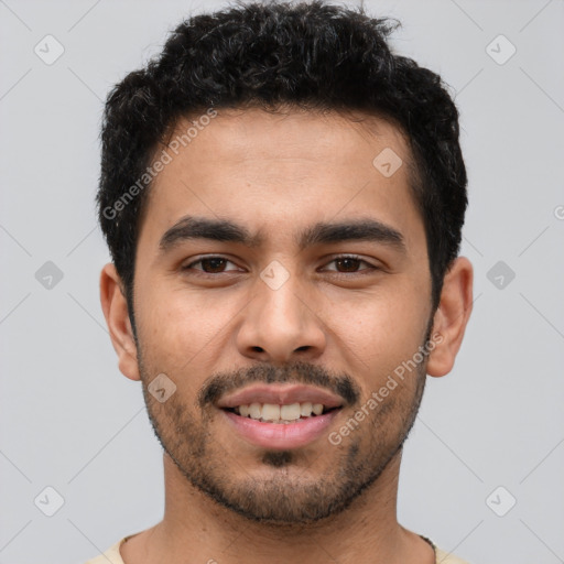 Joyful latino young-adult male with short  brown hair and brown eyes