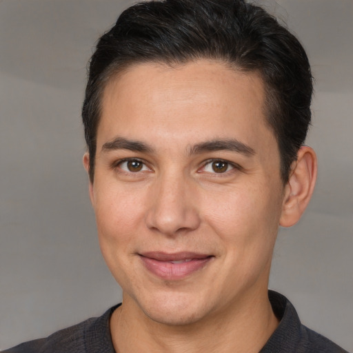 Joyful white adult male with short  brown hair and brown eyes