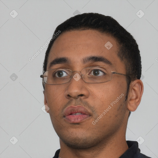 Neutral latino young-adult male with short  black hair and brown eyes