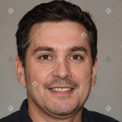 Joyful white adult male with short  brown hair and brown eyes