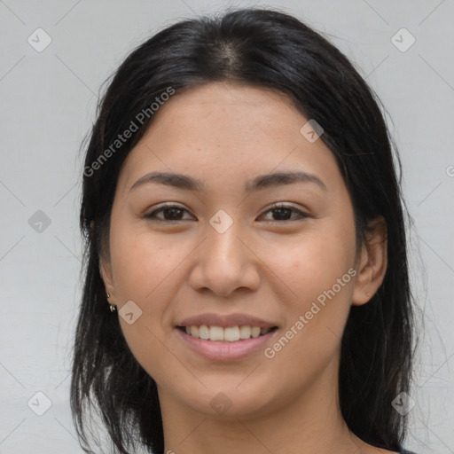 Joyful asian young-adult female with long  brown hair and brown eyes