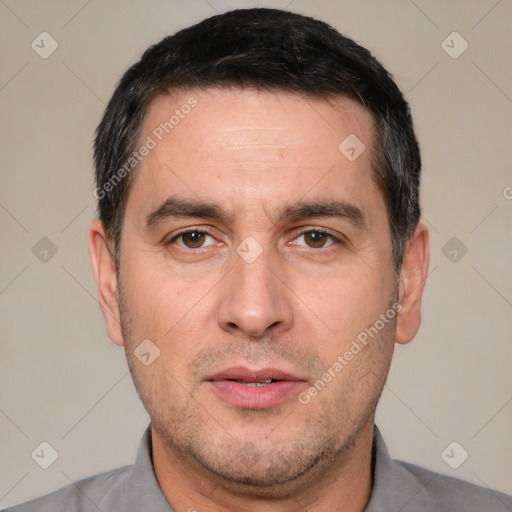 Neutral white adult male with short  black hair and brown eyes