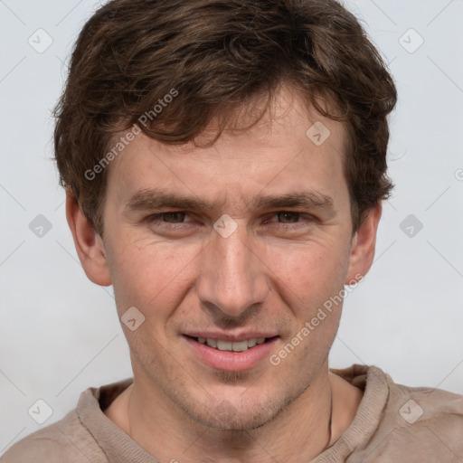 Joyful white adult male with short  brown hair and grey eyes