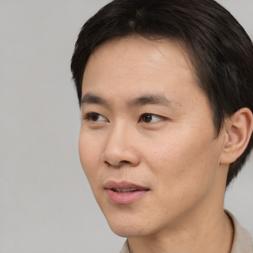 Neutral asian young-adult male with short  black hair and brown eyes