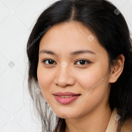 Joyful asian young-adult female with long  brown hair and brown eyes