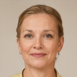 Joyful white adult female with short  brown hair and grey eyes