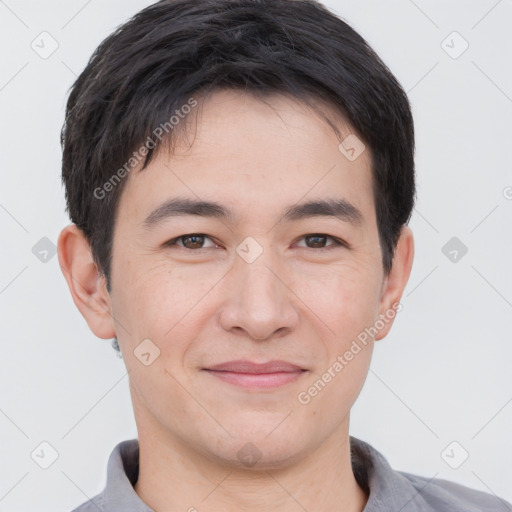 Joyful white young-adult male with short  black hair and brown eyes