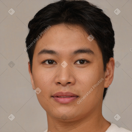 Joyful asian young-adult male with short  brown hair and brown eyes