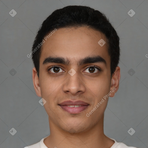 Joyful latino young-adult male with short  black hair and brown eyes