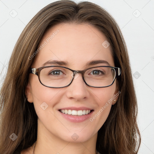 Joyful white young-adult female with long  brown hair and blue eyes