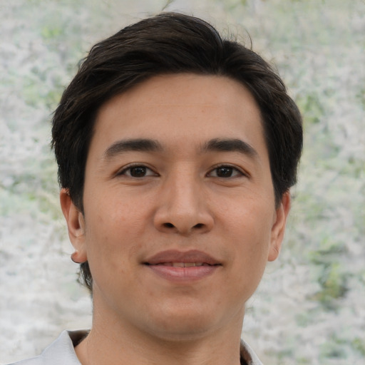 Joyful asian young-adult male with short  brown hair and brown eyes