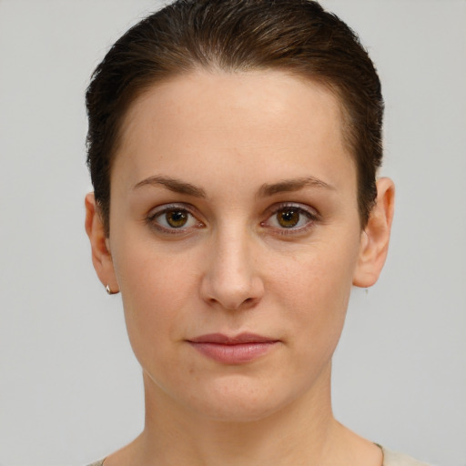 Joyful white young-adult female with short  brown hair and brown eyes