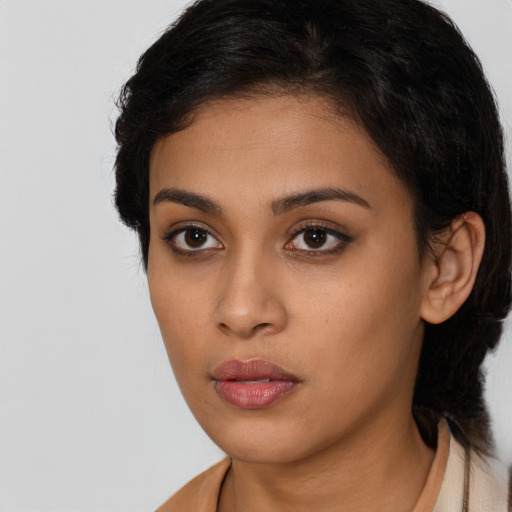 Neutral latino young-adult female with long  brown hair and brown eyes