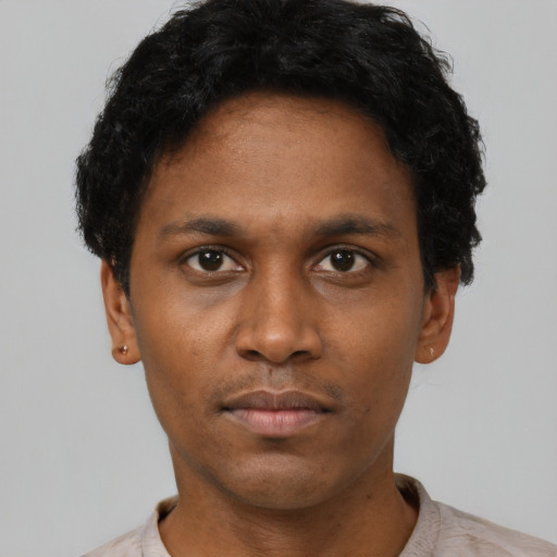 Neutral black young-adult male with short  black hair and brown eyes