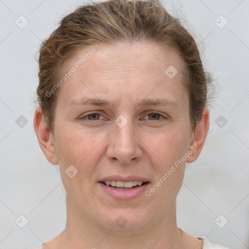 Joyful white young-adult female with short  brown hair and grey eyes