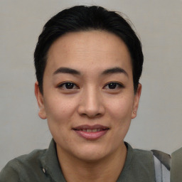 Joyful asian young-adult female with short  black hair and brown eyes