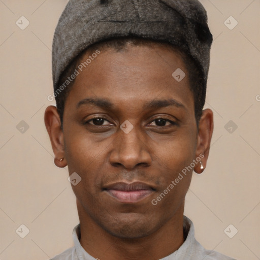 Joyful black young-adult male with short  black hair and brown eyes