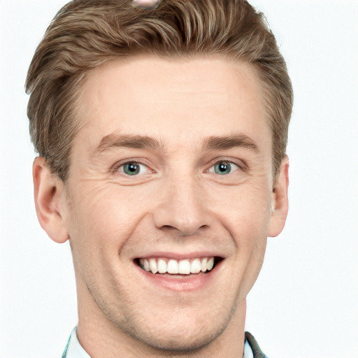 Joyful white young-adult male with short  brown hair and blue eyes