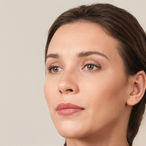 Neutral white young-adult female with medium  brown hair and brown eyes