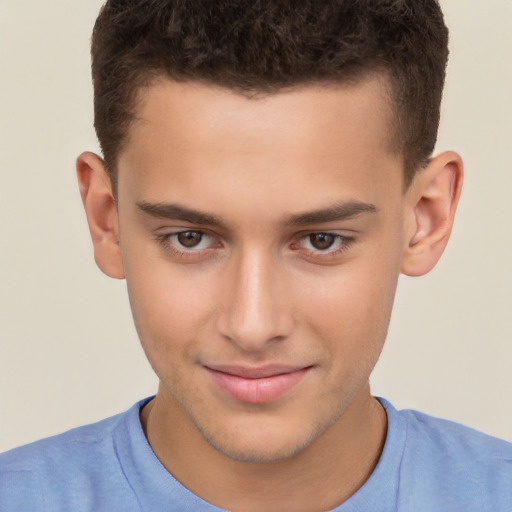 Joyful white child male with short  brown hair and brown eyes