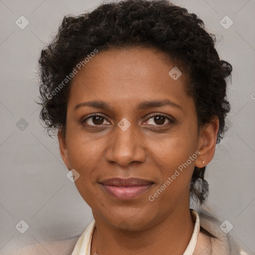 Joyful black adult female with short  brown hair and brown eyes
