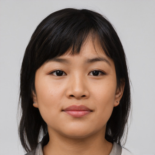 Neutral asian young-adult female with medium  brown hair and brown eyes