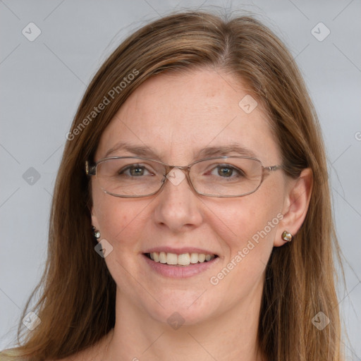 Joyful white adult female with long  brown hair and grey eyes