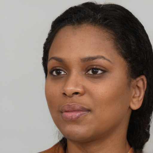 Neutral black young-adult female with long  black hair and brown eyes
