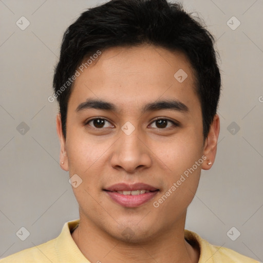 Joyful latino young-adult male with short  brown hair and brown eyes