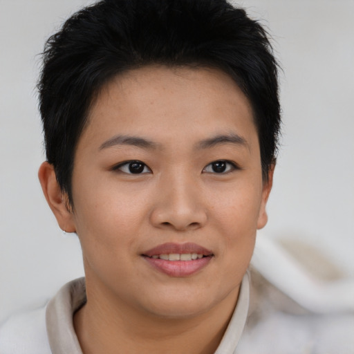 Joyful asian young-adult female with short  brown hair and brown eyes