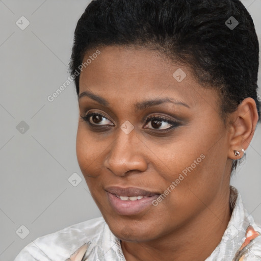 Joyful black young-adult female with short  brown hair and brown eyes