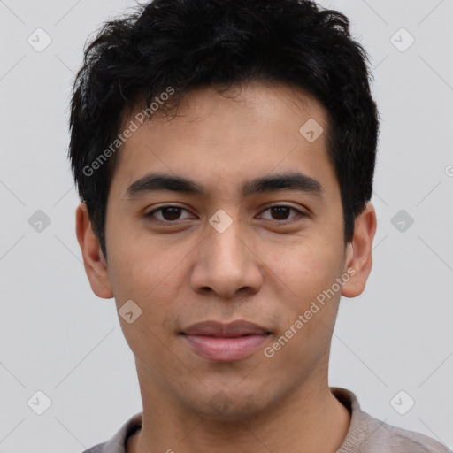 Joyful latino young-adult male with short  black hair and brown eyes