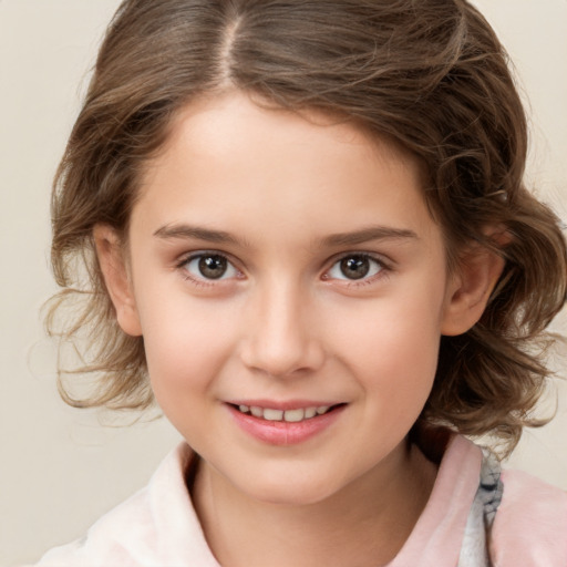 Joyful white child female with medium  brown hair and brown eyes