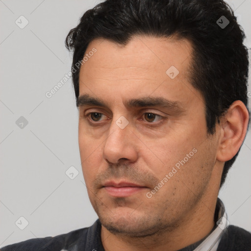 Neutral white adult male with short  black hair and brown eyes