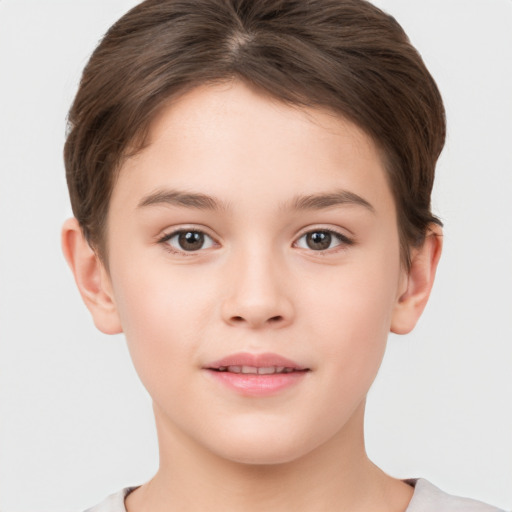 Joyful white child female with short  brown hair and brown eyes