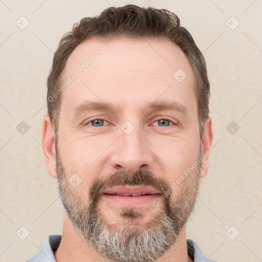 Joyful white adult male with short  brown hair and grey eyes