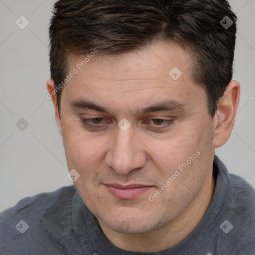 Joyful white adult male with short  brown hair and brown eyes