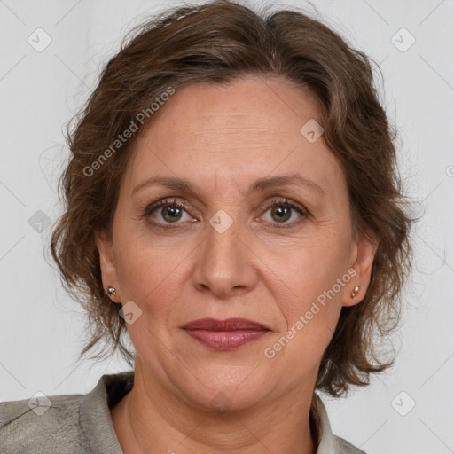 Joyful white adult female with medium  brown hair and grey eyes